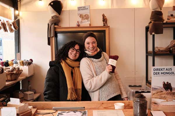 Two people laughing at the camera