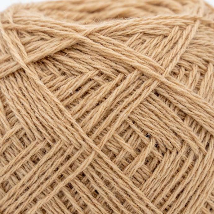 Close-up of a yarn made from beige camel wool
