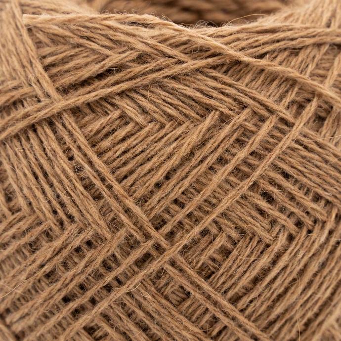 Close-up of a yarn made from beige camel wool
