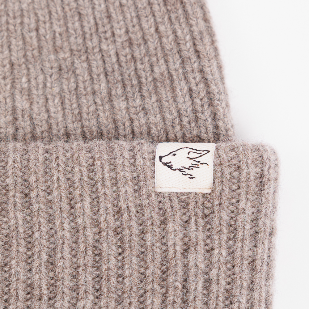 Mütze aus Yakwolle, Detail Logo